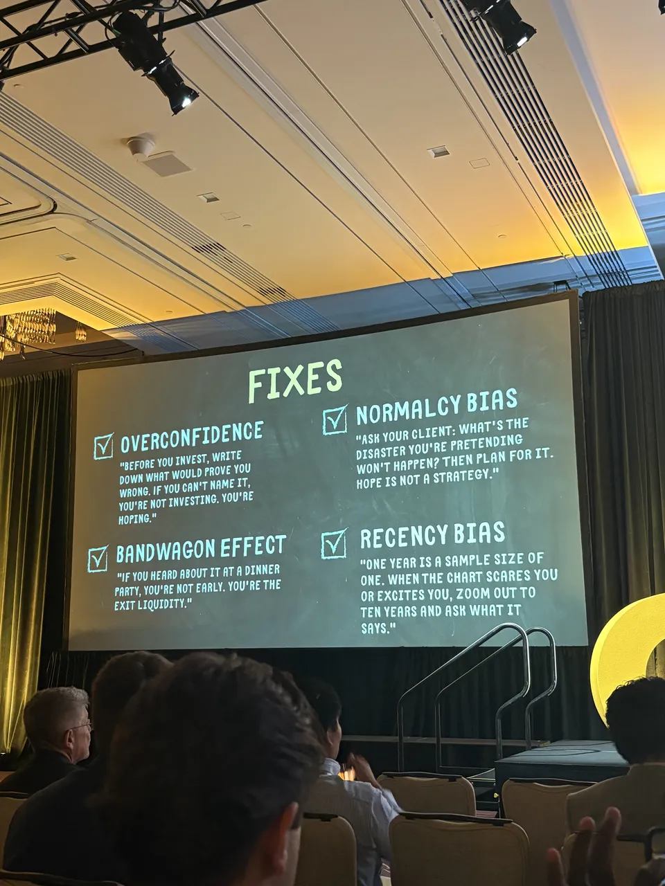 Slide：Fixes，列出 Overconfidence、Normalcy Bias、Bandwagon Effect、Recency Bias 四种偏差和对应建议