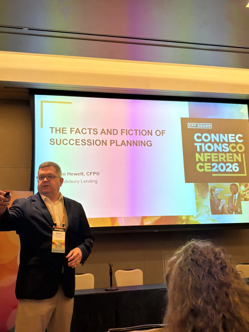 Wayne Hewett 在分会场演讲，背后 slide 写着 The Facts and Fiction of Succession Planning